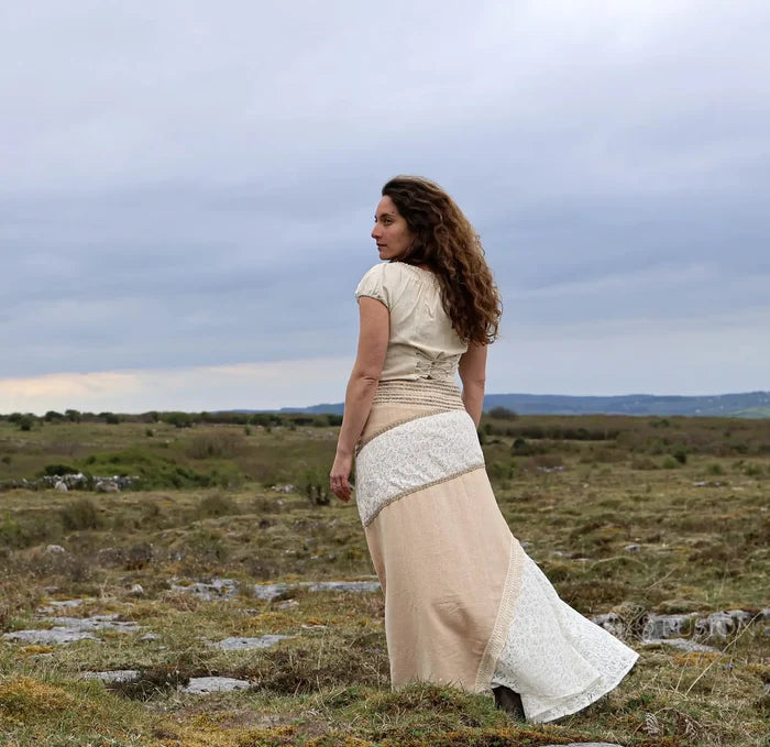 Back view of Banda sustainable skirt design showing natural cotton jute panels, lace patchwork and flowing earthy maxi silhouette