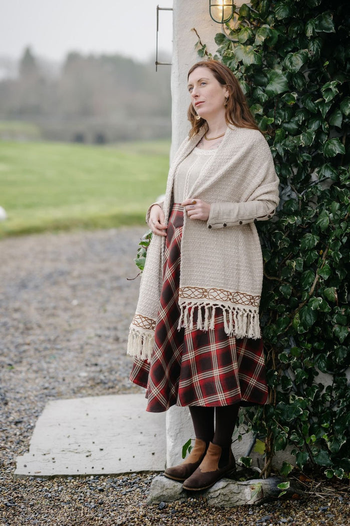 Irish designer cotton shawl in soft beige with tassel fringe and celtic embroidered woven trim perfect for festivals and weddings