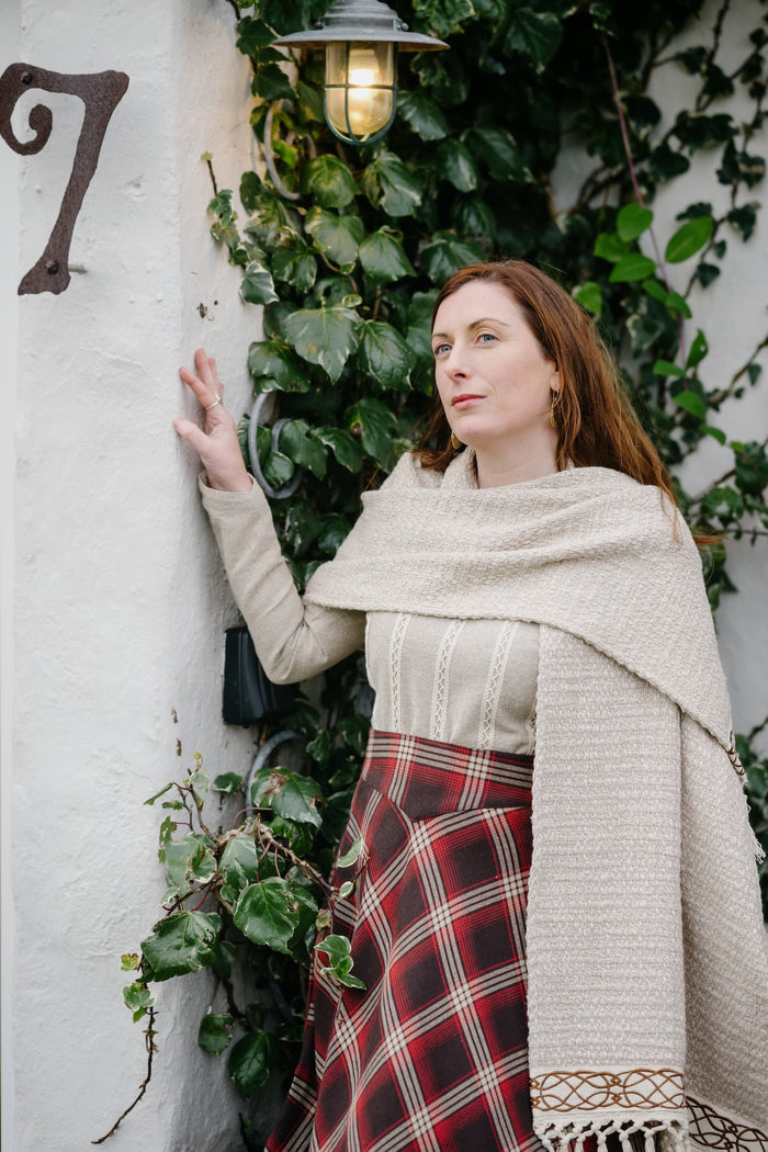 Woven cotton scarf with fringe and Celtic embroidery trim styled as an elegant folklore wrap