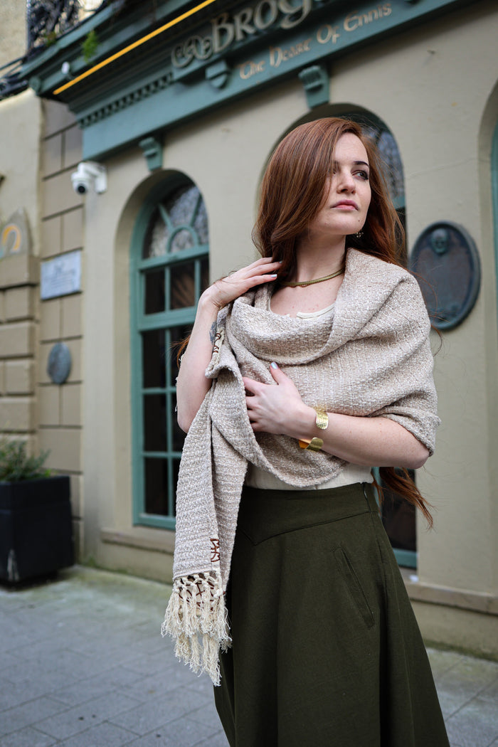 Celtic Fusion soft oatmeal beige cotton shawl with handwoven texture, tasselled fringe and decorative Celtic border