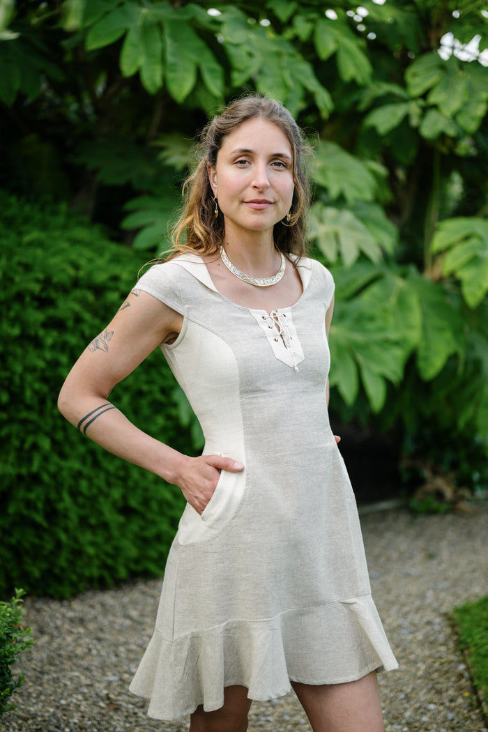 Natural Beige hooded dress with pockets, lace-up neckline and softly flared hem in natural cotton designed by Celtic Fusion