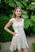 Natural Beige hooded dress with pockets, lace-up neckline and softly flared hem in natural cotton designed by Celtic Fusion