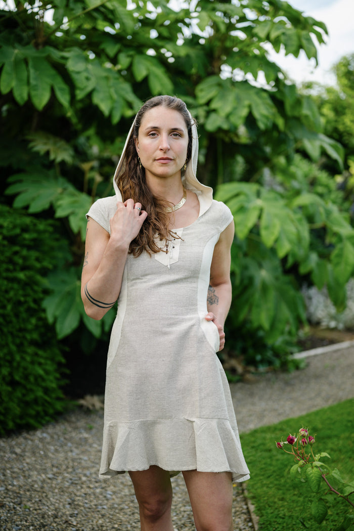 Celtic Fusion Beige hooded mini dress with front lace-up detail, contrasting panels and practical pockets.