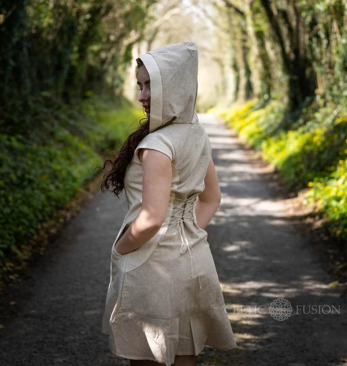 Beige hooded dress with pockets and corset lace-up back and softly flared mini hem in breathable cotton.