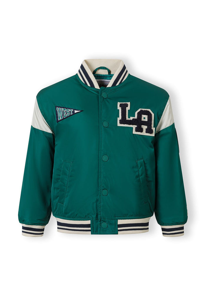 Boys varsity bomber jacket in teal with embroidered details, front view.