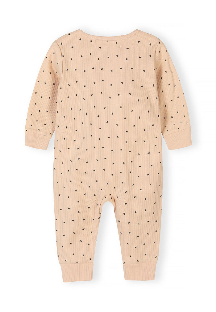 Detail of a beige rib-knit romper for baby boys with black polka dots, back view.