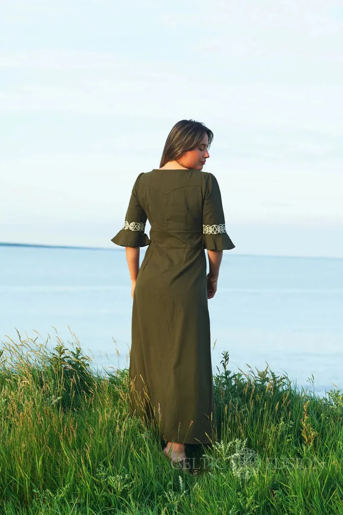 Back view of green Celtic embroidered dress in cotton slub, full length moss green dress with embroidered sleeves and fitted shape