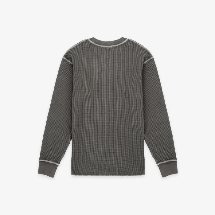 A dark gray ribbed knit long-sleeve shirt with contrasting light gray piping details along the shoulders, cuffs, and collar, shown flat against a light gray background.