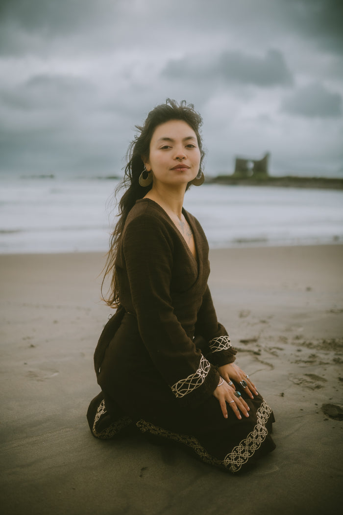 Elva brown wrap cardigan with long sleeves, V-neckline and contrasting Celtic embroidery.