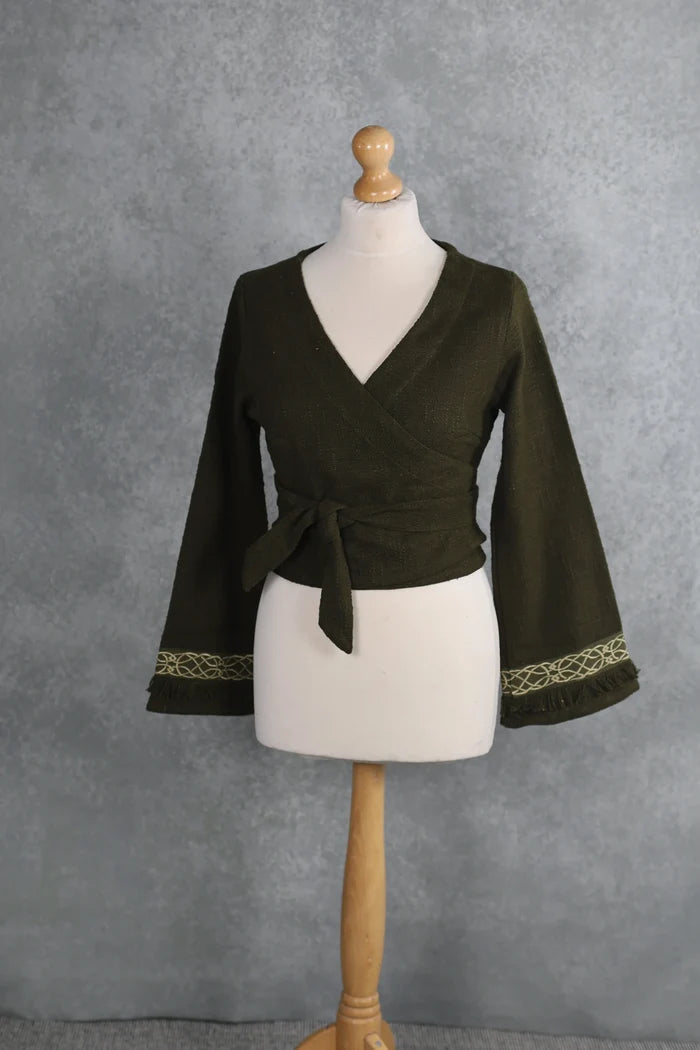 Olive green folklore wrap top with a V-neck crossover front, adjustable waist ties and embroidered bell cuffs.