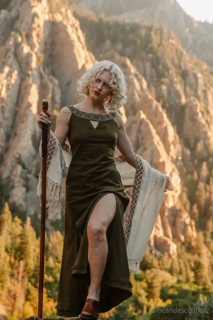 Celtic embroidered neckline dress in forest green, close-up showing knotwork detail and soft V opening at the front