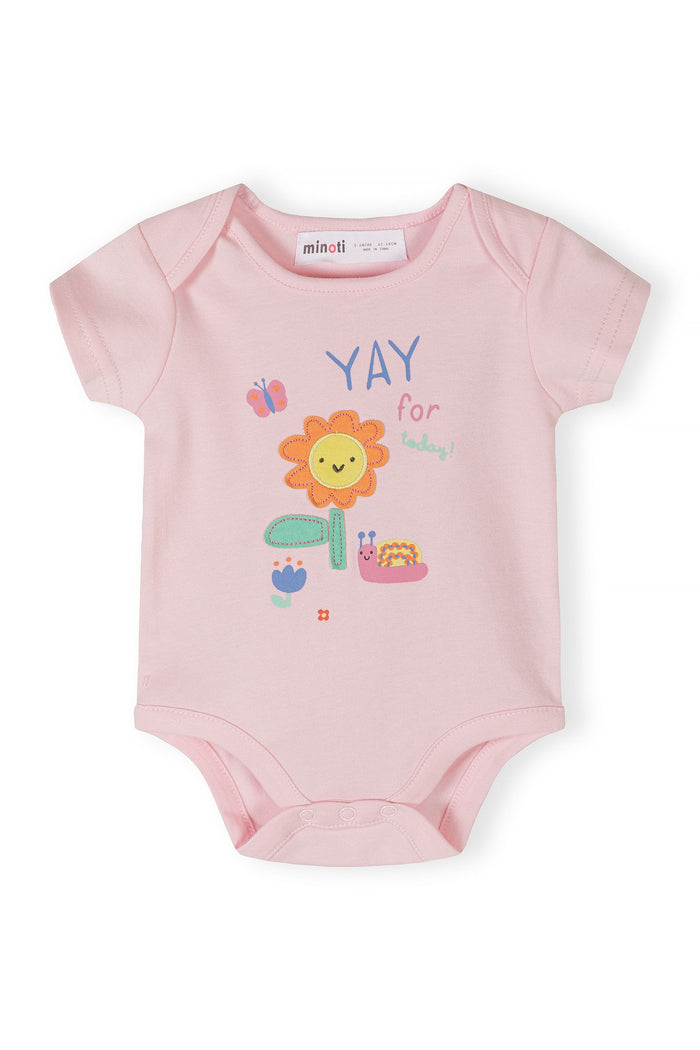 Close-up of a pink short-sleeve bodysuit with a flower and butterfly print.