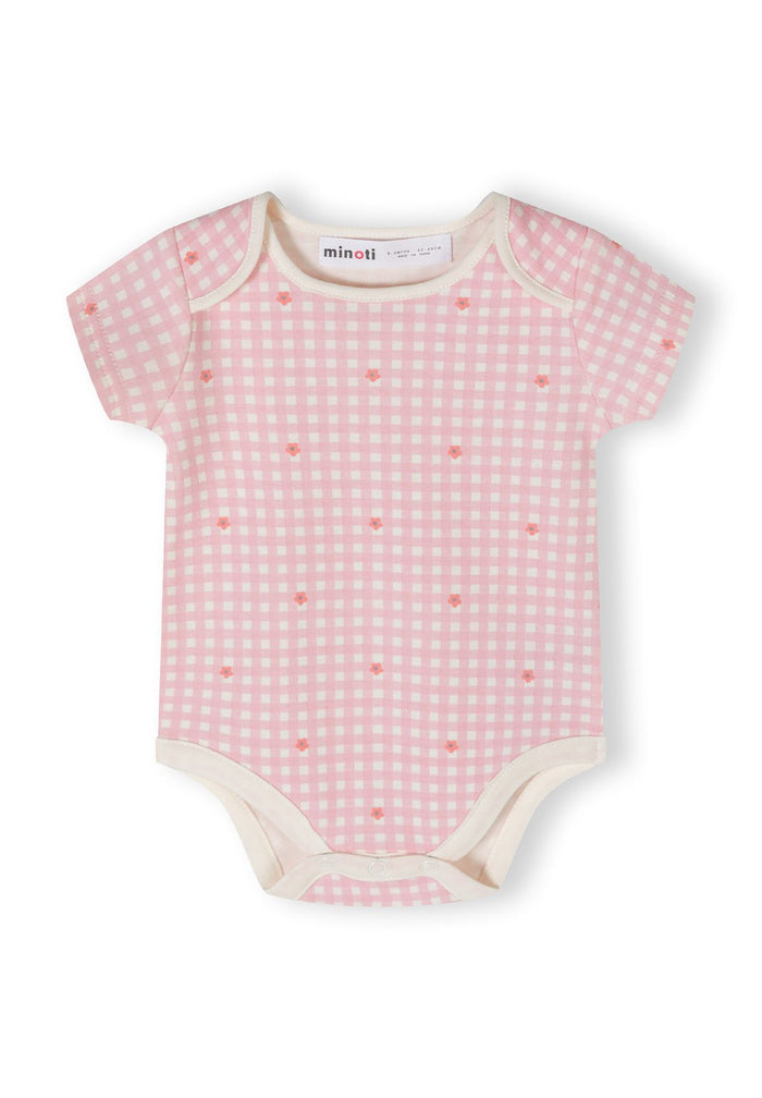 Light pink short sleeve bodysuit with checkered pattern and floral prints, close-up view.