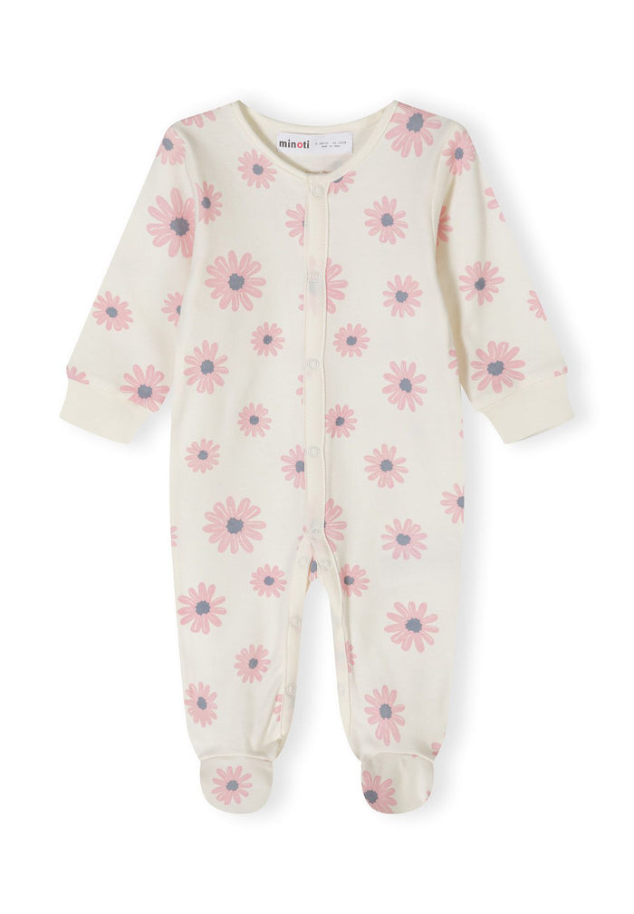 Detail of a girls' long-sleeve sleepsuit in cream with pink floral pattern and integrated feet.