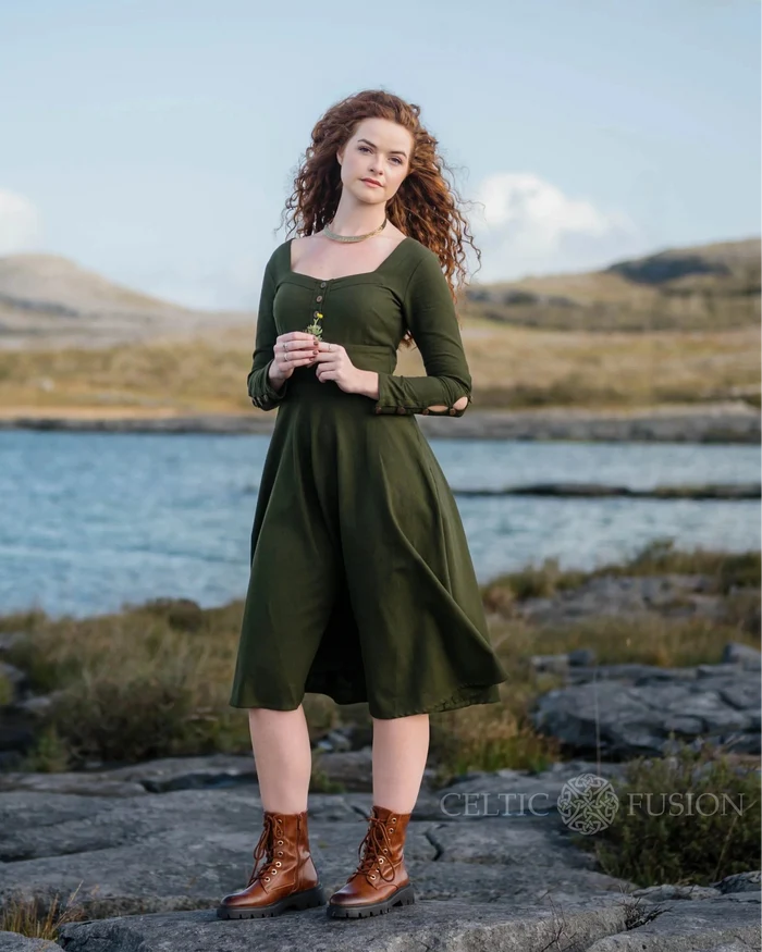 Imbas Corset Dress front view in dark green, a folklore midi dress with sleeves, square neckline and flowing skirt