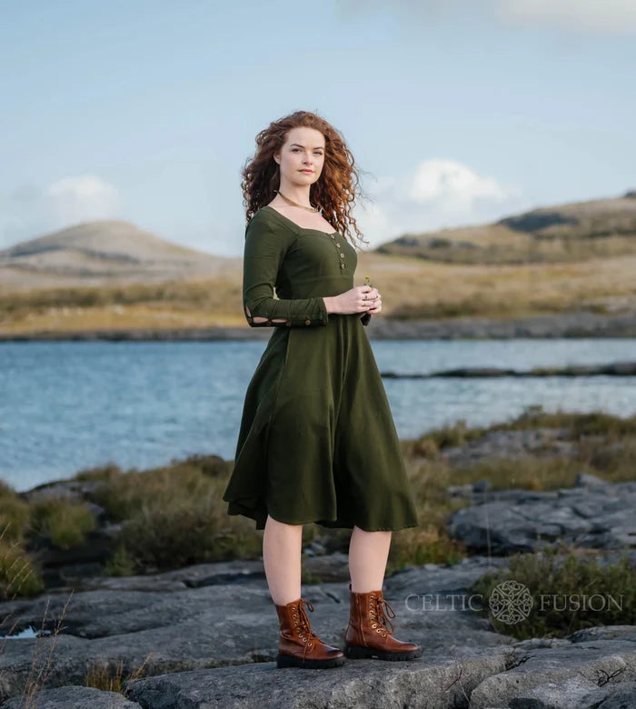 Dark green folklore dress with sleeves side view, Imbas Corset Dress in breathable cotton slub with a soft romantic silhouette photographed in the Burren Ireland