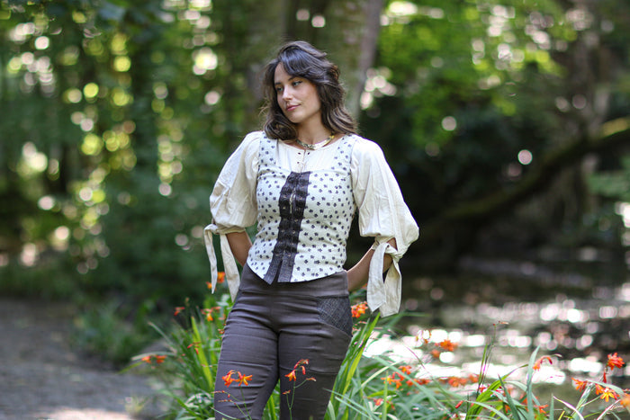 Cream leaf print layering corset top styled with a long blouse for a folklore-inspired outfit.