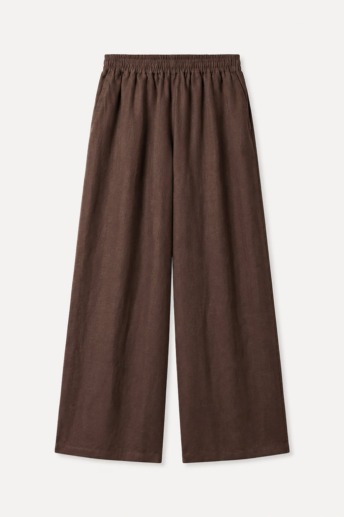 Brown wide-leg pants on a light beige background