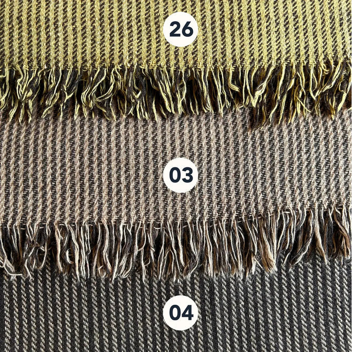 Wool blend shawl colour options with handwoven striped texture and fringe edge in earthy folklore tones