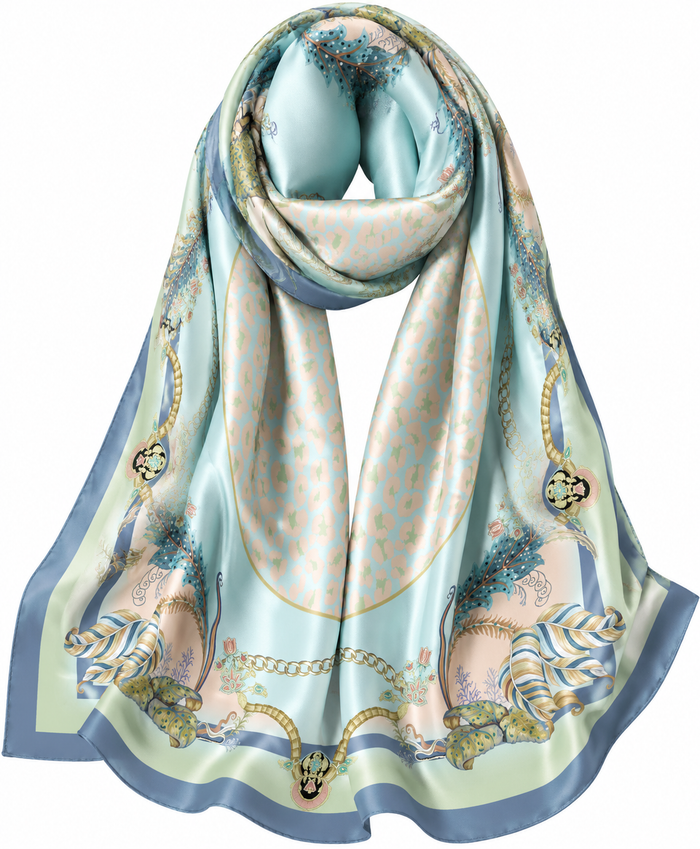 Hamida designer square scarf with pastel botanical artwork, gold chain motifs, soft blue background, and luxury silk texture.