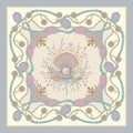 Close-up of Hamida silk scarf showing pearl centerpiece and floral pattern