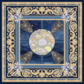 Decorative scarf with floral design and gold border on a blue background