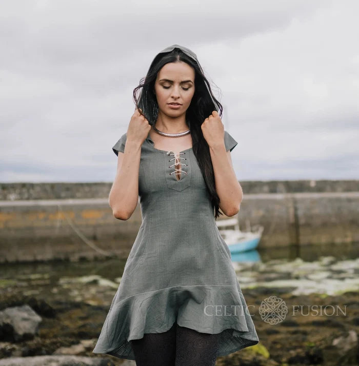 Slate blue hooded cotton dress with an adjustable fit, side pockets and flowing high-low ruffle hem.