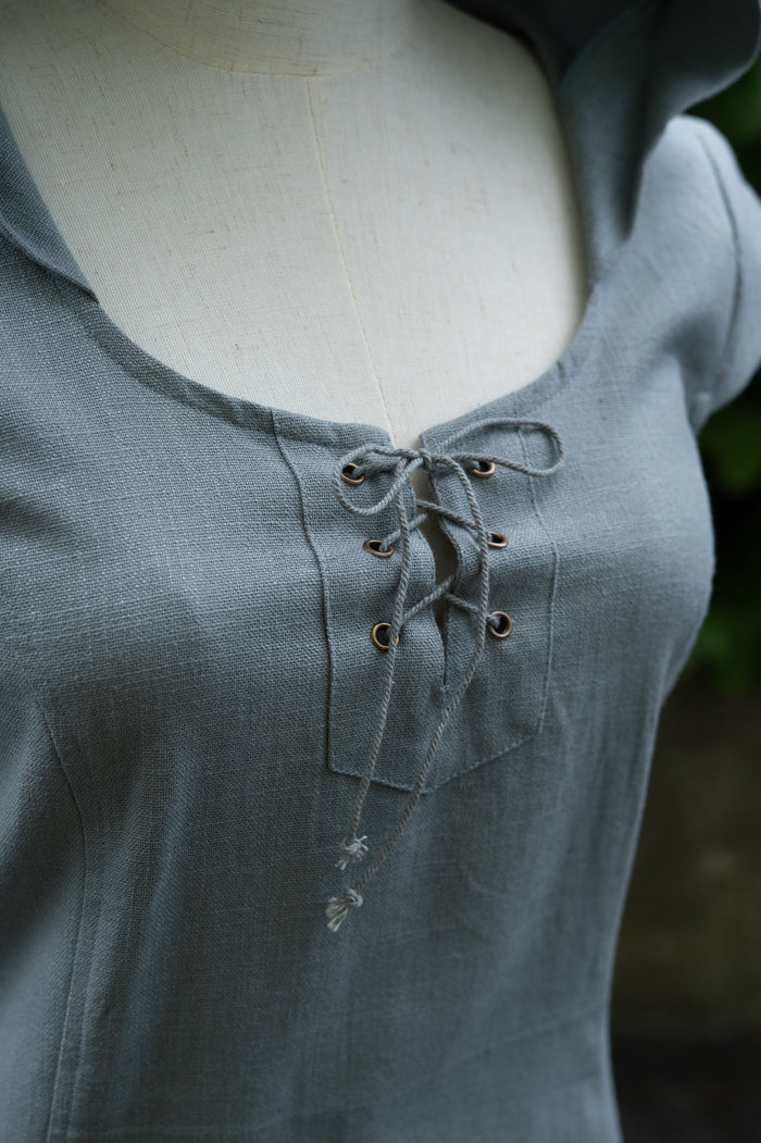 Slate blue hooded corset dress with lace-up neckline