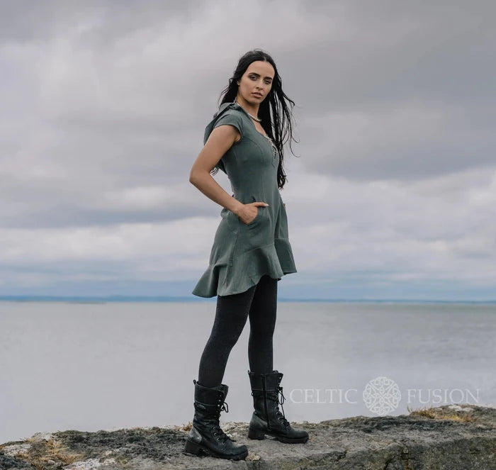Slate blue corset dress with deep curved pocket, fitted waist, relaxed hood and softly dipped hem by Celtic Fusion Irish designer