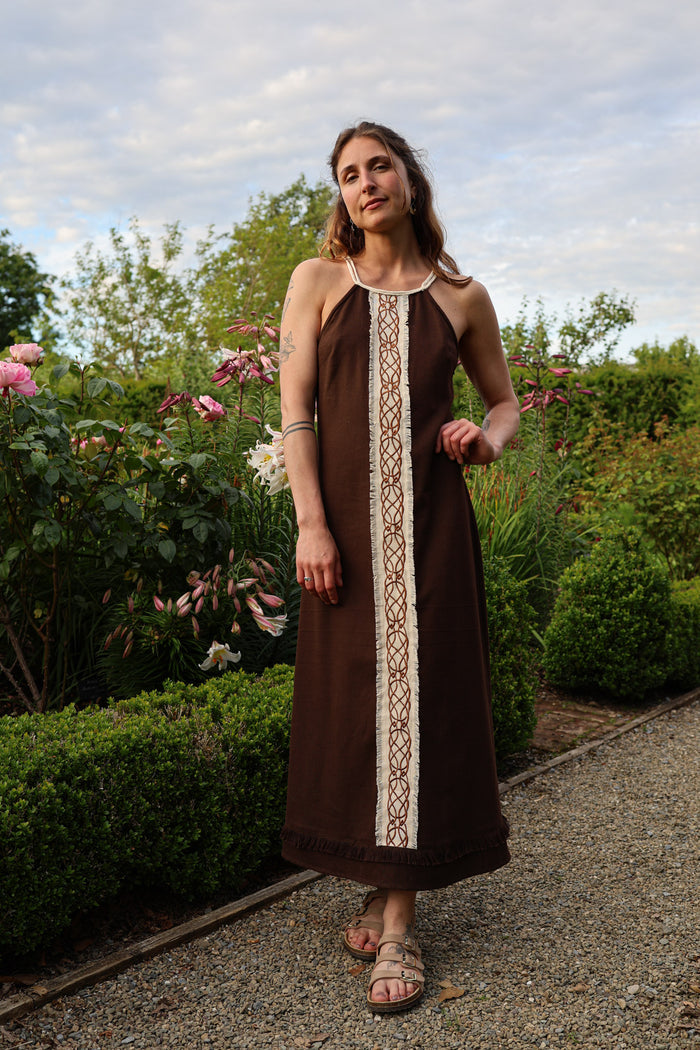 Sleeveless Brown Celtic Dress with central Celtic knotwork embroidery in a long brown boho maxi dress silhouette
