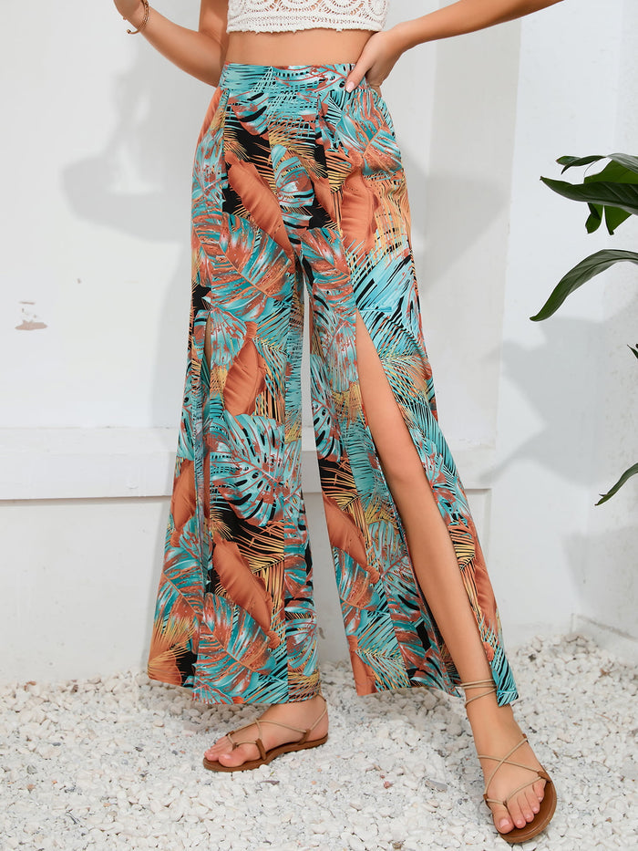 Women's printed wide leg pants in tropical print with front split detail and vacation styling